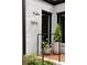 Exterior home detail showcasing the brick facade, address, and well-maintained landscaping at 1656 N Pelham Ne Rd, Atlanta, GA 30324