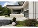 Modern home with a glass-enclosed patio and attached garage at 1656 N Pelham Ne Rd, Atlanta, GA 30324
