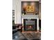Elegant fireplace with black tile surround and white mantel creates a warm and inviting focal point at 1656 N Pelham Ne Rd, Atlanta, GA 30324