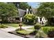 Charming two-story home with manicured lawn, mature trees, and beautiful landscaping at 1656 N Pelham Ne Rd, Atlanta, GA 30324