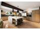 Bright kitchen features a large island with a marble countertop, modern appliances, and hardwood floors at 1656 N Pelham Ne Rd, Atlanta, GA 30324