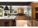 Modern kitchen featuring stainless steel appliances, marble countertops, and custom cabinets at 1656 N Pelham Ne Rd, Atlanta, GA 30324