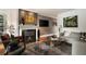 Cozy living room with fireplace, stylish furniture, and modern decor for comfortable living at 1656 N Pelham Ne Rd, Atlanta, GA 30324