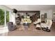Bright living room featuring comfortable seating, a view to the kitchen, and large windows with natural light at 1656 N Pelham Ne Rd, Atlanta, GA 30324