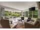 Bright living room with floor to ceiling windows and sliding doors that open to an outdoor living space at 1656 N Pelham Ne Rd, Atlanta, GA 30324