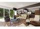 Bright and airy living room with large windows, hardwood floors, and open concept design at 1656 N Pelham Ne Rd, Atlanta, GA 30324