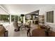 Open concept living space with large windows, inviting seating, and an adjacent kitchen, blending comfort and functionality at 1656 N Pelham Ne Rd, Atlanta, GA 30324
