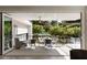 Outdoor patio with ample seating and glass railings overlooking lush landscaping at 1656 N Pelham Ne Rd, Atlanta, GA 30324