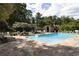 Outdoor pool area with stone patio and lounge chairs, perfect for relaxation and entertainment at 1656 N Pelham Ne Rd, Atlanta, GA 30324