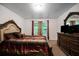Spacious main bedroom with ample closet space and a large window overlooking the backyard at 3155 Tarian Way, Decatur, GA 30034
