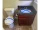 Compact bathroom featuring a toilet and vanity, ready for your personal touch at 5114 Rock Eagle Dr, Stone Mountain, GA 30083