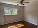 Bedroom with hardwood floors, a ceiling fan, and plenty of natural light through dual windows at 5114 Rock Eagle Dr, Stone Mountain, GA 30083