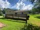 Spacious wooden deck perfect for outdoor entertaining with a well-maintained lawn at 5114 Rock Eagle Dr, Stone Mountain, GA 30083