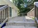 Wooden deck with railing overlooking lush greenery and the backyard at 5114 Rock Eagle Dr, Stone Mountain, GA 30083