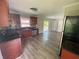 Renovated kitchen with stainless steel appliances and granite countertops, flowing into an open dining area at 5114 Rock Eagle Dr, Stone Mountain, GA 30083
