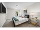 Modern bedroom with a large window, stylish furniture, and a mounted TV at 1004 Bayrose Cir, East Point, GA 30344