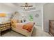 A well-lit bedroom features a tray ceiling and a stylish upholstered headboard at 1004 Bayrose Cir, East Point, GA 30344