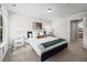 This bedroom features neutral colors, a decorative pillow, and a comfortable bed at 1004 Bayrose Cir, East Point, GA 30344