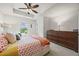 A well-lit bedroom features a tray ceiling and a stylish upholstered headboard at 1004 Bayrose Cir, East Point, GA 30344
