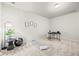 This bonus room features neutral colors, space for exercise, and room to work at 1004 Bayrose Cir, East Point, GA 30344