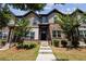 Charming townhome featuring a brick facade, landscaped front yard, and inviting entrance at 1004 Bayrose Cir, East Point, GA 30344