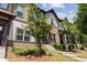 Well-maintained townhome complex showcasing brick and siding exteriors with manicured landscaping at 1004 Bayrose Cir, East Point, GA 30344