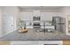 Modern kitchen boasts a large center island, stainless steel appliances, and white cabinets at 1004 Bayrose Cir, East Point, GA 30344
