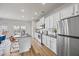 Bright kitchen featuring stainless steel appliances, granite counters, and center island with barstool seating at 1004 Bayrose Cir, East Point, GA 30344