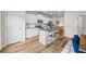 Modern kitchen featuring white cabinetry, stainless steel appliances, and an island with seating at 1004 Bayrose Cir, East Point, GA 30344
