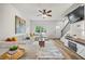 Cozy living room with hardwood floors, a comfortable sofa, and a view of the staircase and entrance at 1004 Bayrose Cir, East Point, GA 30344