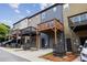 This townhome features a back porch, gray garage, and exterior storage space at 1004 Bayrose Cir, East Point, GA 30344