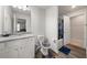 Clean bathroom featuring patterned toilet seat cover, patterned bath mat, and granite counter at 11640 Mendenhall Ct, Hampton, GA 30228