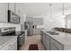 Well-equipped kitchen with stainless steel appliances, granite countertops, and ample cabinet space at 11640 Mendenhall Ct, Hampton, GA 30228