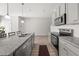 Modern kitchen features granite countertops, stainless steel appliances, and a breakfast bar at 11640 Mendenhall Ct, Hampton, GA 30228