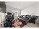 The living room features a large sectional sofa, a TV, and a bright window at 11640 Mendenhall Ct, Hampton, GA 30228