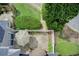 Aerial view of a fenced-in patio area with a patio table with umbrella and manicured landscaping at 563 Trillum Sw Ct # 563, Marietta, GA 30008