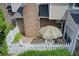 Aerial view of a fenced-in patio area with a patio table with umbrella and manicured landscaping at 563 Trillum Sw Ct # 563, Marietta, GA 30008