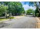 Gated entrance to a private community with mature trees and landscaping, offering security and a welcoming ambiance at 563 Trillum Sw Ct # 563, Marietta, GA 30008