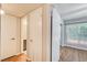 Hallway with hardwood floors, adjacent to the bedroom and bathroom at 563 Trillum Sw Ct # 563, Marietta, GA 30008