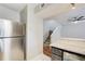 Modern kitchen with stainless steel appliances and bright countertops, with staircase access at 563 Trillum Sw Ct # 563, Marietta, GA 30008