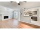 Inviting living room featuring a fireplace, hardwood floors, and open access to the modern kitchen at 563 Trillum Sw Ct # 563, Marietta, GA 30008