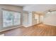 Bright living room with hardwood floors, large window, and neutral paint at 563 Trillum Sw Ct # 563, Marietta, GA 30008