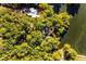 Breathtaking aerial view of expansive property on the water surrounded by lush green trees at 8316 Hewlett Rd, Sandy Springs, GA 30350