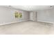 Carpeted bedroom with a window and a ceiling light fixture, painted in a neutral tone at 8316 Hewlett Rd, Sandy Springs, GA 30350