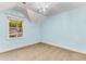 Cozy bedroom with a chandelier and window offering natural light and treetop views at 8316 Hewlett Rd, Sandy Springs, GA 30350