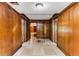 Detailed entrance foyer with wood paneled walls and tile flooring at 8316 Hewlett Rd, Sandy Springs, GA 30350