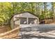 Detached two-car garage offers ample space and convenience with an elongated driveway at 8316 Hewlett Rd, Sandy Springs, GA 30350