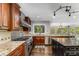 Gourmet kitchen with stainless steel appliances, granite countertops, custom cabinetry and view to Dining Room at 8316 Hewlett Rd, Sandy Springs, GA 30350