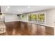 Spacious living room featuring hardwood floors, recessed lighting, and sliding glass doors to the deck at 8316 Hewlett Rd, Sandy Springs, GA 30350