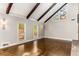 Elegant living room with hardwood floors, exposed beams, and natural light at 8316 Hewlett Rd, Sandy Springs, GA 30350